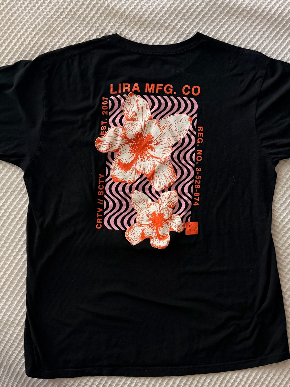 Lira Black Short-Sleeve Tee with Orange Floral Graphic